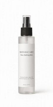 Mossicare Dew Setting Mist — clear plastic spray bottle with black pump and minimalist white label, front product shot on a light background