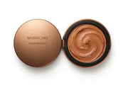 Mossicare Cream Bronzer — open compact top view, swirled pan